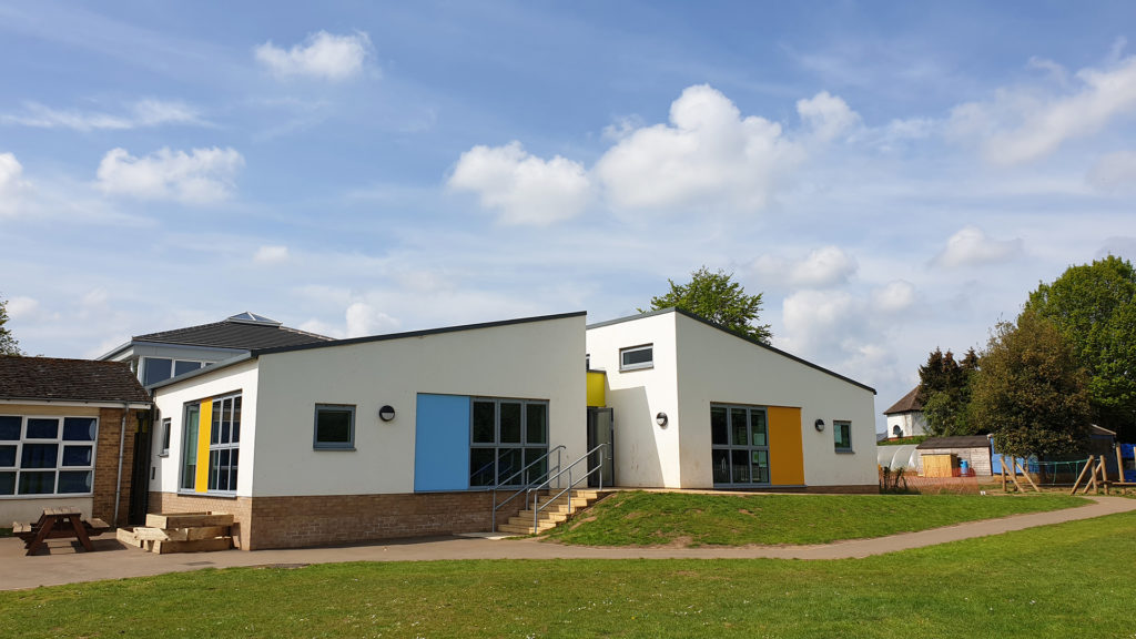 Christopher Rawlins School Adderbury white render coloured cladding extension building