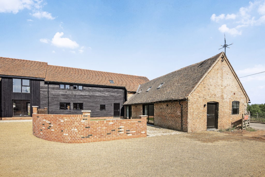 Barn conversion stable painted brick and stained timber Stratford Upon Avon Warwickshire weather vain courtyard